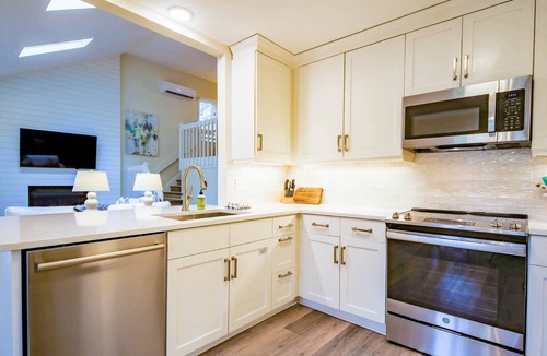 West Beach House | 10 Minute Walk to Beach! Two Primary Suites, Bunk Bedroom, Den with Pool Table, Expansive Back Porch