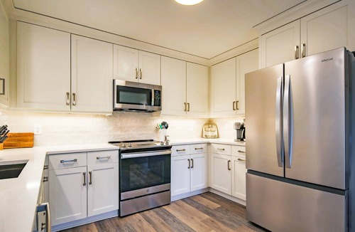 West Beach House | 10 Minute Walk to Beach! Two Primary Suites, Bunk Bedroom, Den with Pool Table, Expansive Back Porch