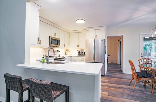 West Beach House | 10 Minute Walk to Beach! Two Primary Suites, Bunk Bedroom, Den with Pool Table, Expansive Back Porch