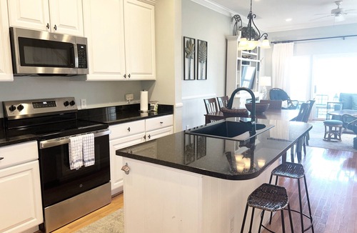Waters Edge House | 120 Waters Edge! Community pool, screen porch, easy walk to beach, 2 blocks from Center St.
