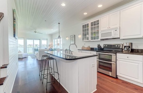 Waters Edge House | 124 Waters Edge! Riverfront Town Home! Screened porch, Community Pool, & Fishing Dock!