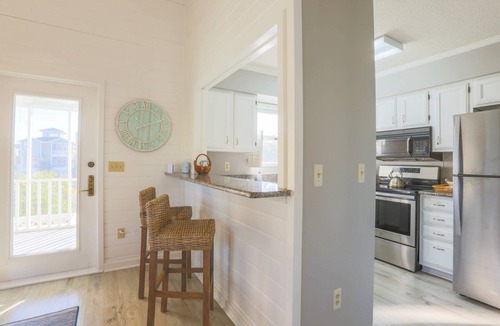 Pelican Bay House | Beach Home with Lagoon Views, Screened Porch, Deck & Community Pool. Only 5 Minute Walk to Beach!