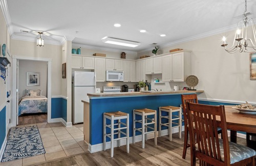 Central Myrtle Beach Condo | Bright and Modern 3BR Family Friendly Condo with pool, golf, Ripken Experience.