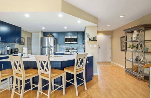 Shelter Cove Villa | Charming bay view villa with pool, washer & dryer, balcony, TV, & full kitchen