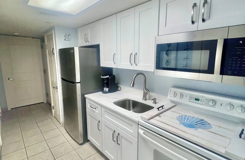 Crescent Beach Resort | Coastal Beachfront Paradise! Resort Style Amenities with a BRAND NEW KITCHEN!