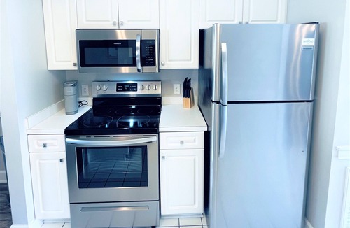 Central Myrtle Beach Condo | Endless Summer Coastal Condo at Magnolia Place - Pool & Golf Course Views!