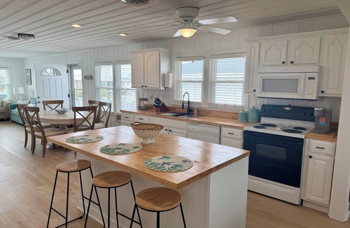 North Myrtle Beach Cottage | Fabulous 4-bedroom channel home with private dock in Cherry Grove Beach.