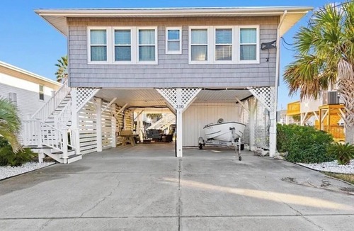 North Myrtle Beach Cottage | Fabulous 4-bedroom channel home with private dock in Cherry Grove Beach.