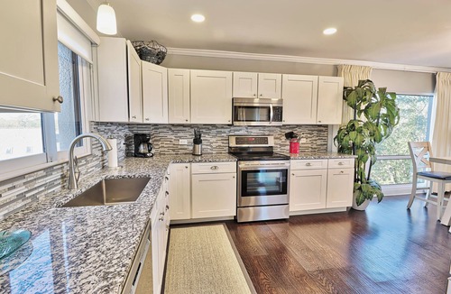 North Litchfield Beach Condo | Fourth Floor Condo across from Beach Access, Balcony, Pool, Grill Area, Elevator