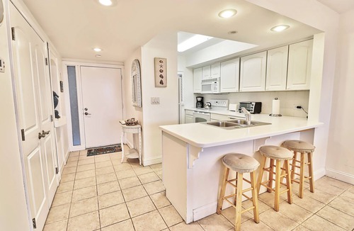North Litchfield Beach Condo | Fourth Floor Condo across from Beach Access, Balcony, Pool, Grill Area, Elevator