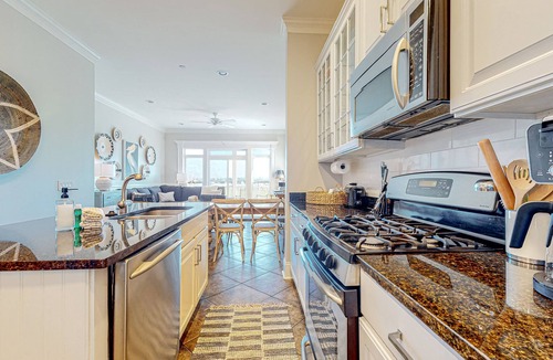 Waters Edge House | Inviting waterfront townhouse with beach access, balcony, W/D, pool & dock