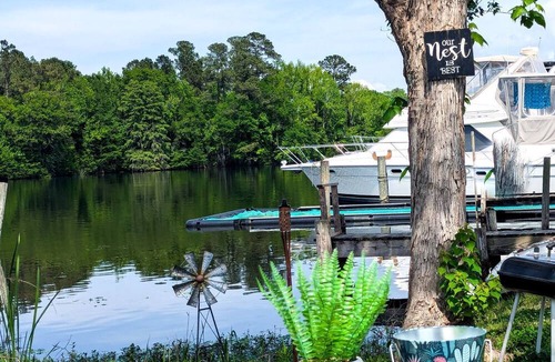 Eutawville RV Rental | Lakeside Glamping Tent with Kayaks & Spacious Deck in Eutaw Springs, South Carolina