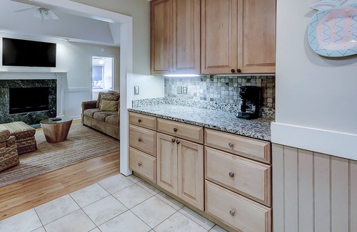 West Beach Condo | Modern, one-level condo near beach & golf with deck, sunroom, & pool