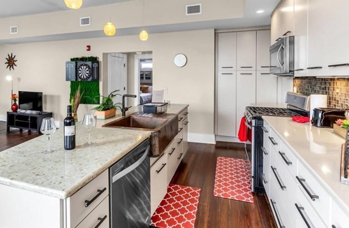Downtown Greensboro Condo | Newly remodeled penthouse suite with city view! Spacious open layout! Walking distance to must-see attractions! Private deck! Free high-speed Internet!