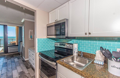 Myrtle Beach Apartment | Over-sized Luxury Balcony with teak loungers! Modern Style in the Golden Mile