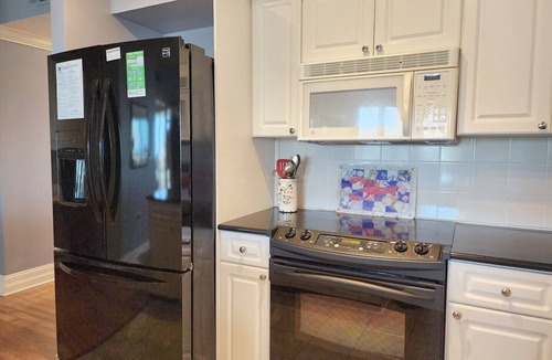 Litchfield by the Sea Condo | Paget 403 Features Oceanside Views of Pool & Clubhouse