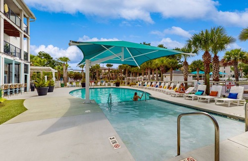 Goose Creek Condo | Stylish 2BR: Pet Friendly in Walkable Resort with a Pool