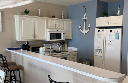 Sunset Beach Condo | Sunset Beach Condo No Cleaning Fee Peaceful Pond & Fountain View