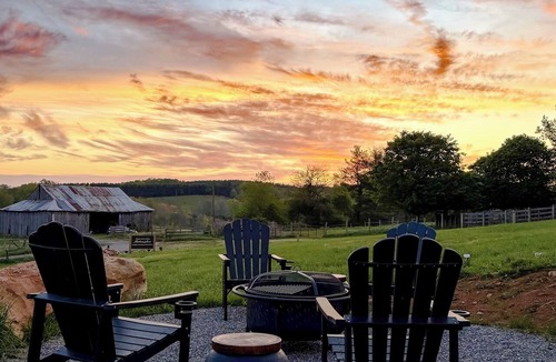 Court House Apartment | Thoughtfully designed two-bedroom retreat in Floyd, Virginia featuring mountain views, a private deck, full kitchen, and shared fire pit access just minutes from downtown Floyd.