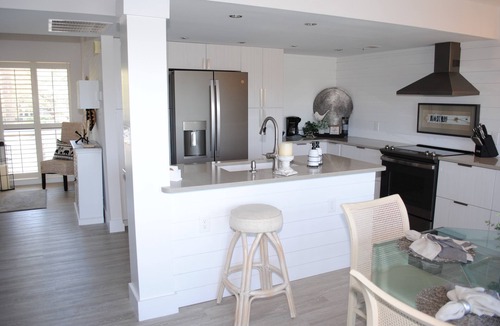 Litchfield by the Sea Condo | Villa with lake views and pool access located within gated Litchfield By the Sea community.