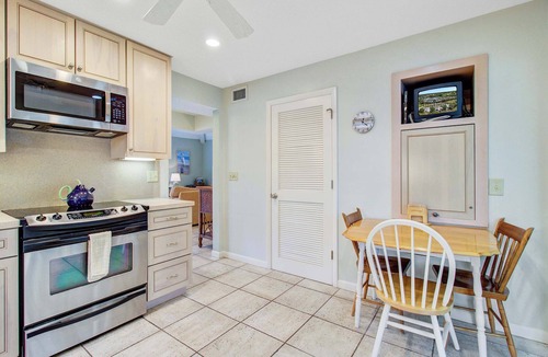 Spinnaker Beachhouses House | Villa with screened porch & fabulous views - just across the street from the beach