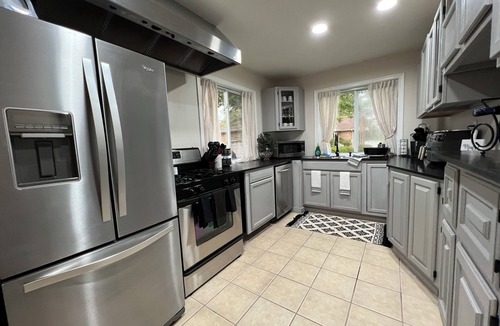 Achilles House | Waterfront Home with stunning views & Hot tub- rent Golf Cart/Kayak/Boat