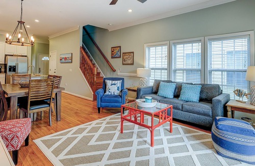 Waters Edge House | Welcoming water view townhome with pool, balcony, deck, & kitchen
