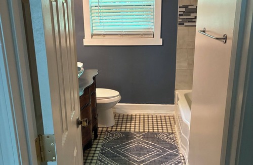 Toddville Road House | West side gem on a half-acre lot. Sunroom for indoor/outdoor living. Book today!