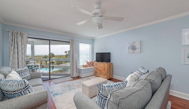 Charming condo with a screened-in porch, water views, and access to complex pool
