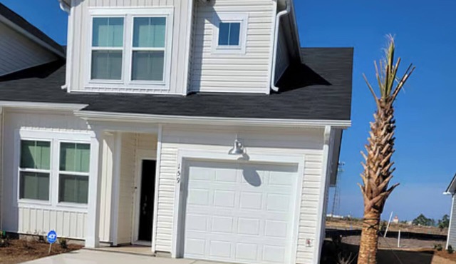 Coastal Charm 3-bedroom townhome with modern comforts and prime location.