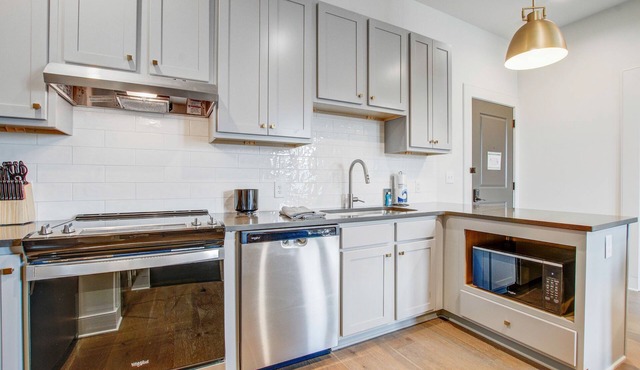 Contemporary condo & connected suite with full kitchen, balcony, rooftop deck