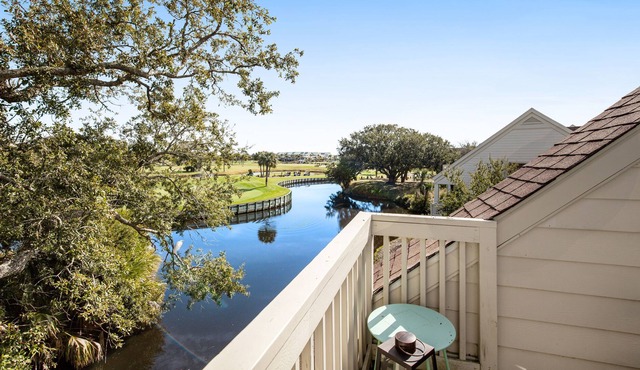 Dog-friendly villa near beach with pool access, patio, central AC & washer/dryer