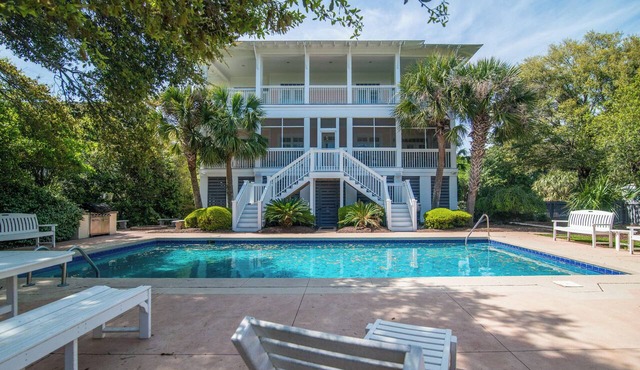 Large 8 bedroom second row beach home with private heated* saltwater swimming pool & hot tub.