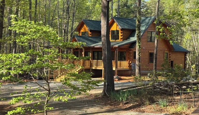 Main Channel Lots of Water-All Decked Out — new lakefront log home on Smith Mountain Lake with a private hot tub, 50+ ft of wraparound deck, fire pit patio & easy lake access. Two full kitchens. One of 5 cabins on an 8-acre lakefront micro-resort. in Union Hall