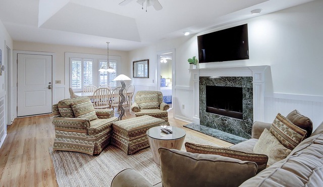 Modern, one-level condo near beach & golf with deck, sunroom, & pool
