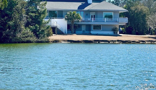 Private 5 bd Waterfront Oasis: 1-Acre Estate with Hidden Pool & 5-Star Luxury