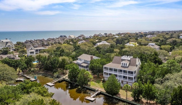 This vibrant family home features 8 bedrooms, and 8 bathrooms, ocean and creek views