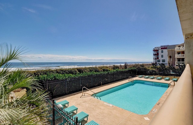 Pelican Watch 104–Oceanfront condo with private beach access, Jacuzzi & pool