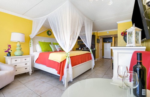 Myrtle Beach Condo | Caribbean Paradise-Romantic Oceanfront Canopy King Suite with Breathtaking Views