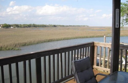Charleston Apartment | Folly Beach Riverfront Apt with dock, private boat ramp kayaks and bikes