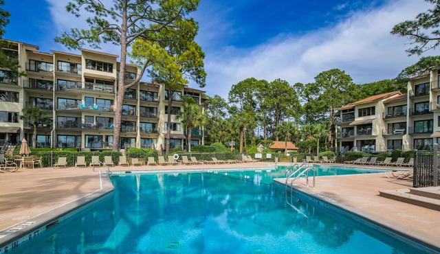 Updated & Gorgeous End Unit with Spectacular Views of Pool & Sound. South Beach Oasis Awaits you!